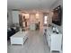 Spacious living area featuring a kitchen, dining space, and living room with modern decor at 1350 N Portofino Dr # 108, Sarasota, FL 34242
