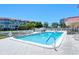Community features a large pool with a deck and lush landscaping at 1350 N Portofino Dr # 108, Sarasota, FL 34242