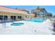 Community features a sparkling pool with a jacuzzi, ample patio space and lush landscaping at 1350 N Portofino Dr # 108, Sarasota, FL 34242