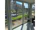 Relaxing sunroom showcasing tranquil waterfront views, lots of natural light, and comfortable seating at 1350 N Portofino Dr # 108, Sarasota, FL 34242