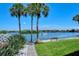 Scenic community water view featuring palm trees and lush greenery at 1350 N Portofino Dr # 108, Sarasota, FL 34242