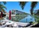 Waterfront condo community with serene views and dockside seating area at 1350 N Portofino Dr # 108, Sarasota, FL 34242
