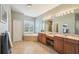 Serene bathroom features a soaking tub, dual vanities, and ample storage, perfect for relaxation and pampering at 1655 Pinyon Pine Dr, Sarasota, FL 34240