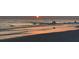 Beautiful beach scene with gentle waves and warm sunset colors over the horizon at 1655 Pinyon Pine Dr, Sarasota, FL 34240
