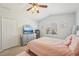 Bright bedroom showcasing a full dresser with a TV, closet and window with shutters at 1655 Pinyon Pine Dr, Sarasota, FL 34240