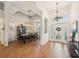 Open-concept dining area with elegant lighting and tile flooring, adjacent to the front entry at 1655 Pinyon Pine Dr, Sarasota, FL 34240