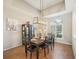Elegant dining area with tray ceiling, stylish lighting and an open layout, perfect for gatherings and entertaining at 1655 Pinyon Pine Dr, Sarasota, FL 34240