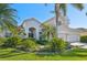 Beautiful home with lush tropical landscaping, a two-car garage, and a stunning exterior, perfect for Gathering living at 1655 Pinyon Pine Dr, Sarasota, FL 34240