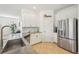 Beautiful kitchen showcasing white cabinets, granite counters, stainless appliances, and stylish backsplash at 1655 Pinyon Pine Dr, Sarasota, FL 34240