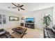 Cozy living area with tile flooring, a ceiling fan and a comfortable seating arrangement at 1655 Pinyon Pine Dr, Sarasota, FL 34240