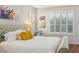 Inviting main bedroom with hardwood floors, plantation shutters, and stylish decor, offering a relaxing retreat at 1655 Pinyon Pine Dr, Sarasota, FL 34240