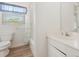 Clean bathroom with a shower-tub combo, white vanity, and updated fixtures at 1730 Hudson St, Englewood, FL 34223