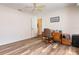 Bedroom featuring hardwood floors, a closet, and wood desk at 1730 Hudson St, Englewood, FL 34223