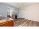 Comfortable bedroom with wood-look floors, built-in shelving, and a ceiling fan at 1730 Hudson St, Englewood, FL 34223