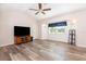 Spacious living room with a large window and modern ceiling fan at 1730 Hudson St, Englewood, FL 34223