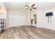 Bright living room with wood floors, vaulted ceilings, and a view into the kitchen at 1730 Hudson St, Englewood, FL 34223