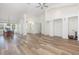 Open-concept home with modern flooring and bright lighting showcasing the dining and living areas at 1730 Hudson St, Englewood, FL 34223