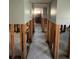 Hallway featuring tile flooring and exposed framing ready for renovation at 1801 Gulf N Dr # 184, Bradenton Beach, FL 34217