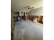 An open room with exposed framing, a ceiling fan, and adjacent spaces at 1801 Gulf N Dr # 184, Bradenton Beach, FL 34217