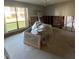 Spacious living room needing renovation with large window and natural light at 1801 Gulf N Dr # 184, Bradenton Beach, FL 34217