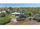 Waterfront property with a lush yard, sandy beach, and serene water views at 2212 6Th W St, Palmetto, FL 34221