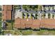 Aerial view of the townhome community, showing parking, lush landscaping, and boat docks at 285 Madeira Cir, Tierra Verde, FL 33715