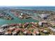 Aerial view of waterfront condos featuring boat docks, and a scenic Gulf Coast location at 285 Madeira Cir, Tierra Verde, FL 33715