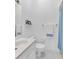 Clean bathroom with white fixtures, a vanity, and a shower with a blue curtain at 285 Madeira Cir, Tierra Verde, FL 33715