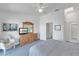 Bedroom featuring ceiling fan, TV, and a white chair at 285 Madeira Cir, Tierra Verde, FL 33715