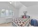 Bright bedroom with patriotic themed quilt, plantation shutters and side table at 285 Madeira Cir, Tierra Verde, FL 33715