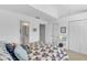 Bright bedroom with patriotic themed quilt, dual closets and bathroom access at 285 Madeira Cir, Tierra Verde, FL 33715