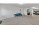 Spacious garage with white block walls, a finished floor, and organized shelving at 285 Madeira Cir, Tierra Verde, FL 33715