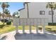 Community mailboxes with landscaped surroundings, columns, and multiple units at 285 Madeira Cir, Tierra Verde, FL 33715