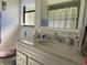 Bathroom featuring a vanity with a granite countertop, toilet, and a framed mirror at 3002 Vivienda Dr # 22, Bradenton, FL 34207