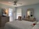 Comfortable bedroom featuring a ceiling fan, neutral colors, and a view to the en suite bath at 3002 Vivienda Dr # 22, Bradenton, FL 34207