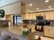 Kitchen featuring stainless steel appliances, stone countertops, tile backsplash and barstool seating at 3002 Vivienda Dr # 22, Bradenton, FL 34207
