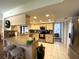 Bright kitchen featuring stainless steel appliances, tile backsplash, granite countertops and a breakfast bar at 3002 Vivienda Dr # 22, Bradenton, FL 34207