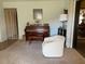 Inviting living room with piano, chair, neutral carpet and side table at 3002 Vivienda Dr # 22, Bradenton, FL 34207