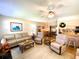 Inviting living room with comfortable seating and bright, open space seamlessly flowing into the dining area at 3002 Vivienda Dr # 22, Bradenton, FL 34207