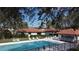 Beautiful pool with lounge chairs and covered area, perfect for relaxing and enjoying the outdoors at 3002 Vivienda Dr # 22, Bradenton, FL 34207
