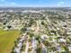 Panoramic aerial view of a residential neighborhood with a charming home with a pool encircled at 3016 Taunton W Dr, Bradenton, FL 34205