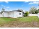 Backyard with a well kept lawn, and white fencing at 3016 Taunton W Dr, Bradenton, FL 34205