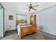 Relaxing bedroom with ceiling fan and neutral color scheme, offering a tranquil space at 3016 Taunton W Dr, Bradenton, FL 34205