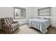 Bright bedroom with ceiling fan and reading chair at 3016 Taunton W Dr, Bradenton, FL 34205