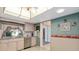 Charming kitchen with unique ceiling feature, stainless steel appliances and a view to the outside at 3016 Taunton W Dr, Bradenton, FL 34205