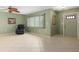 Inviting living room featuring tile flooring, a ceiling fan, and comfortable seating at 3016 Taunton W Dr, Bradenton, FL 34205