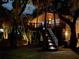 Exterior of house with lights highlighting the front steps at nighttime at 3376 S Seclusion Dr, Sarasota, FL 34239
