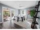 Bright home office with a modern desk, natural light, and access to an outdoor patio at 3376 S Seclusion Dr, Sarasota, FL 34239