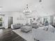 Spacious open-plan living room showcasing wood look floors, recessed lighting and modern furniture at 3376 S Seclusion Dr, Sarasota, FL 34239