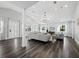 Bright open-plan living room with vaulted ceilings and recessed lighting at 3376 S Seclusion Dr, Sarasota, FL 34239